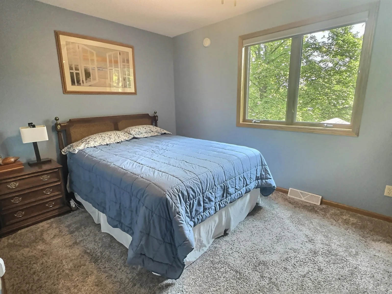 The primary bedroom also offers great views of the lake and is located across the hall from a full bathroom.