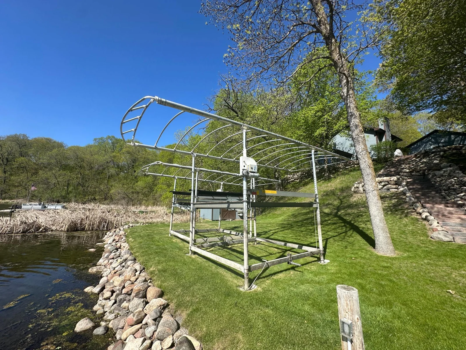Rip Rap Shoreline and nice lakeside yard.  Approximately 117 feet of lake shore graces this property offering plenty of space for relaxing or playing games.