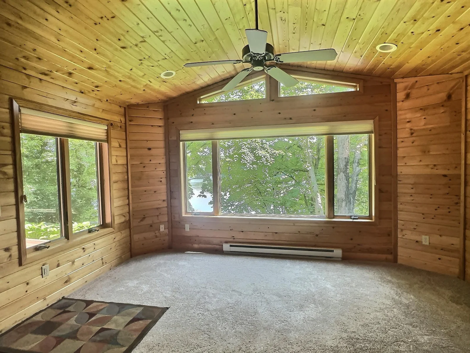 This may possibly be the favorite room in the house!  Cozy, tongue and groove walls and vaulted ceiling offer an up north feel.