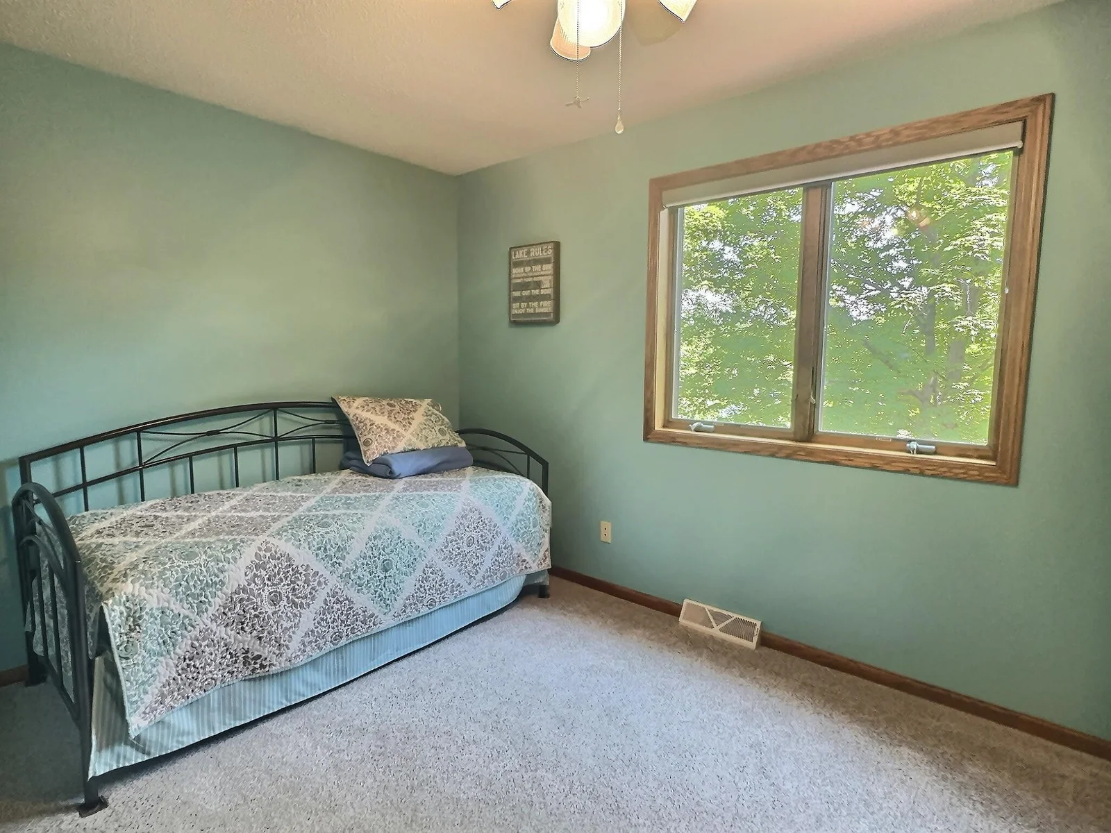 This bedroom has fantastic views of the lake.