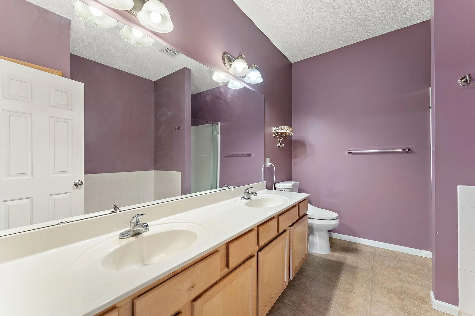 Owner's Suite Private Bath with Double Sinks, Stand-Up Shower, and Large Bath