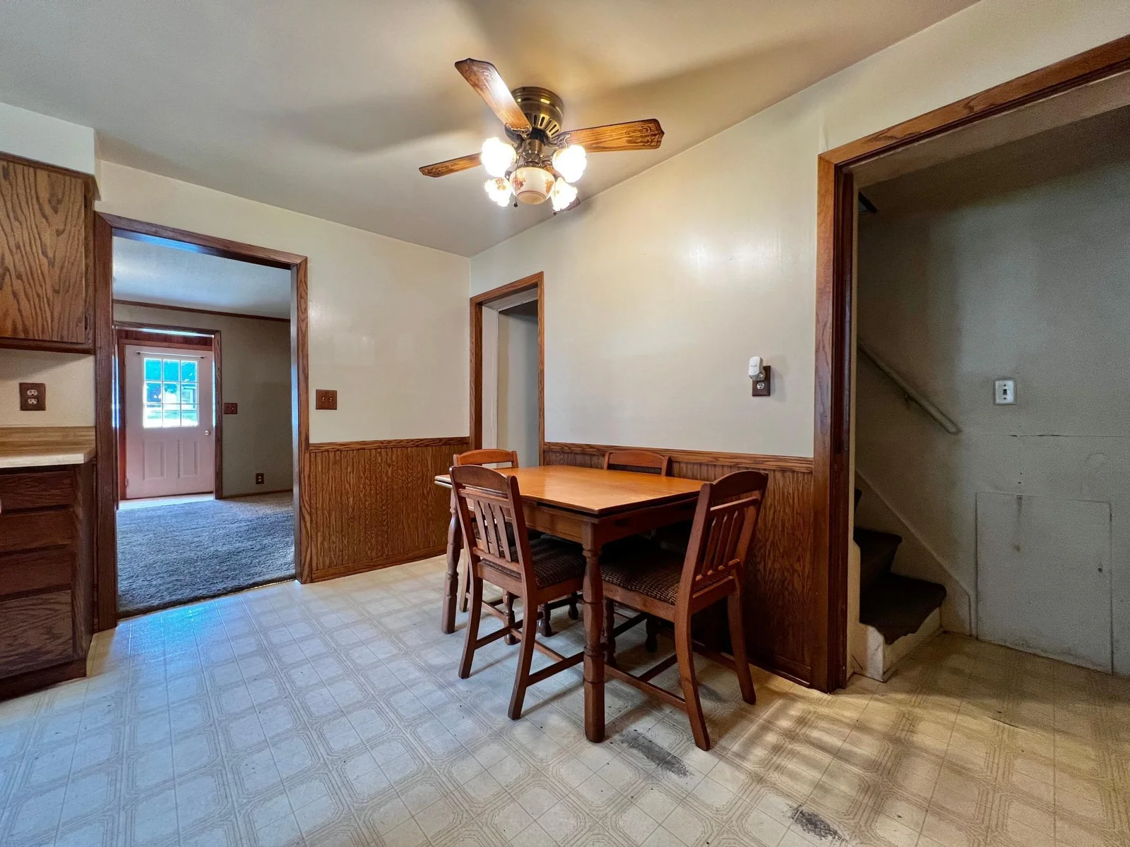 Dining Area with view to Living Room and Stairway to Second Floor