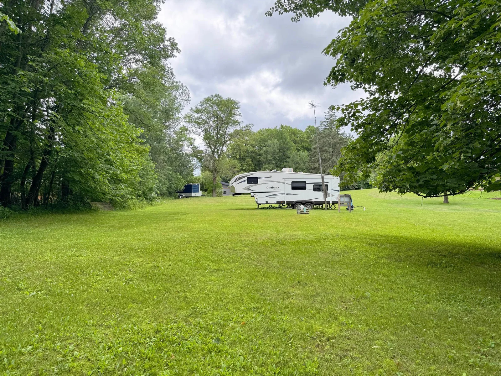 Looking back towards the rear side of the camper and the driveway beyond.