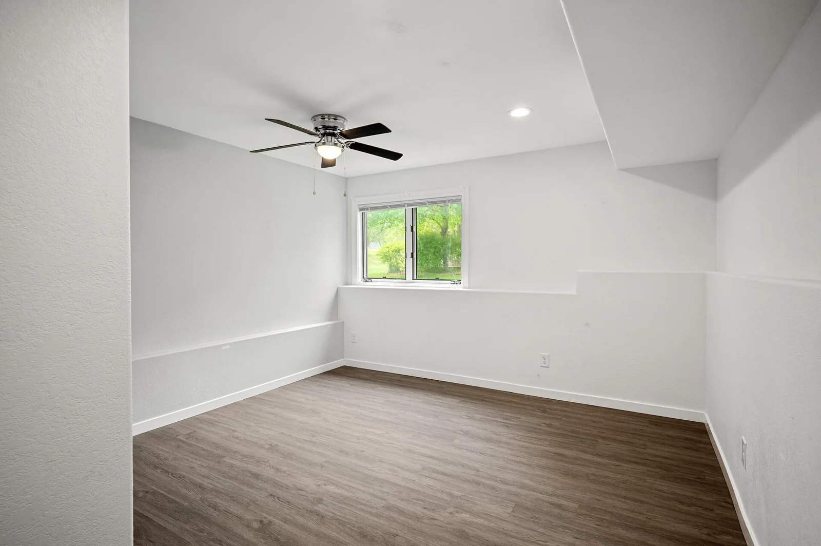 Head to the lower level, and you will find the fourth bedroom!
