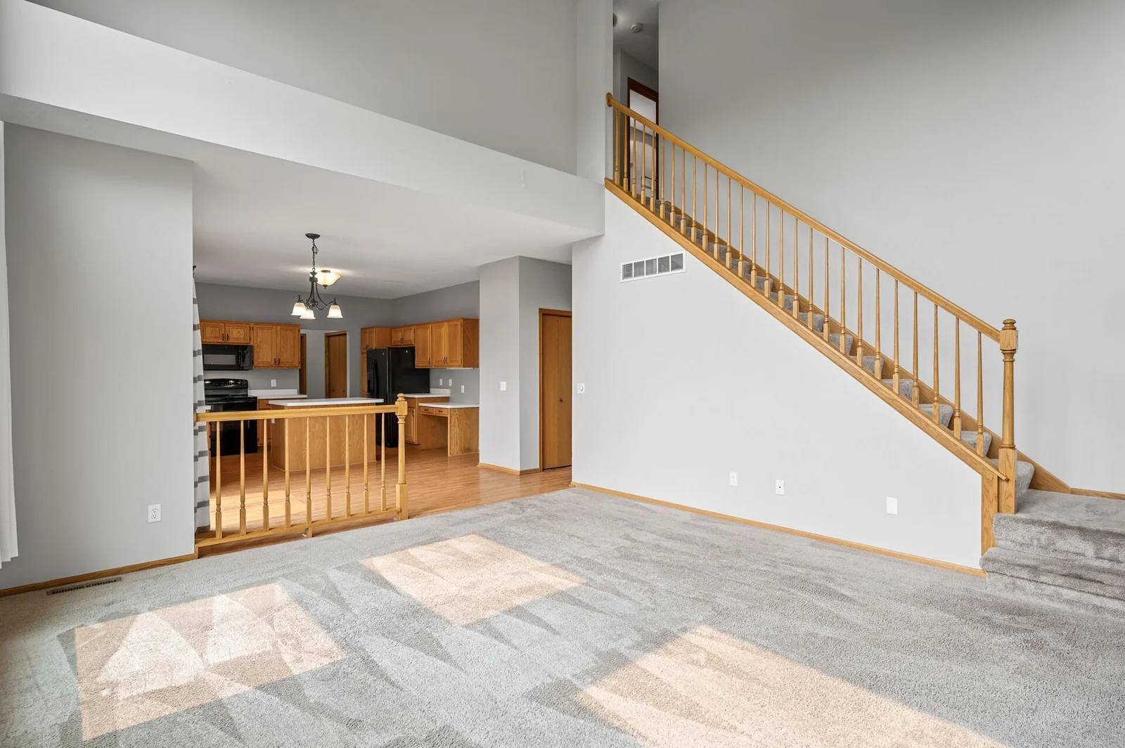 Stairway is tucked away to not impede on the layout. Home is built by local luxury builder Swanson Homes! Remember that the carpet was just professionally cleaned.