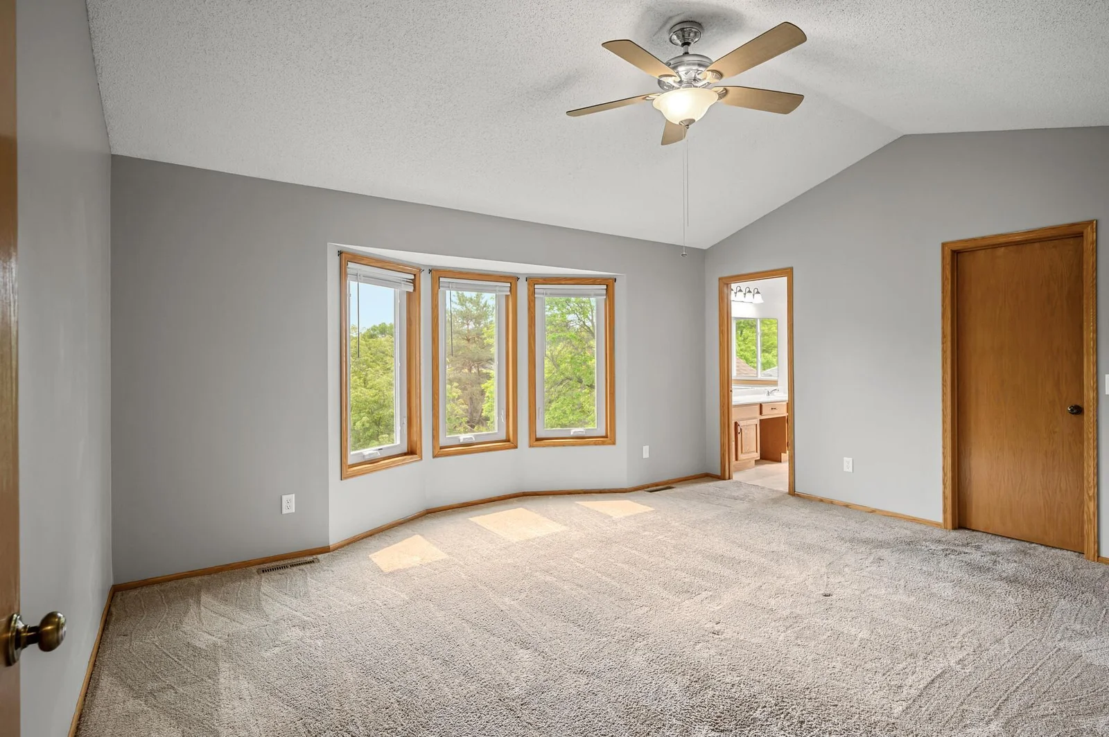 Head upstairs, and you will find the primary bedroom! Vaulted ceiling, bay window, walk in closet, and full private bathroom!