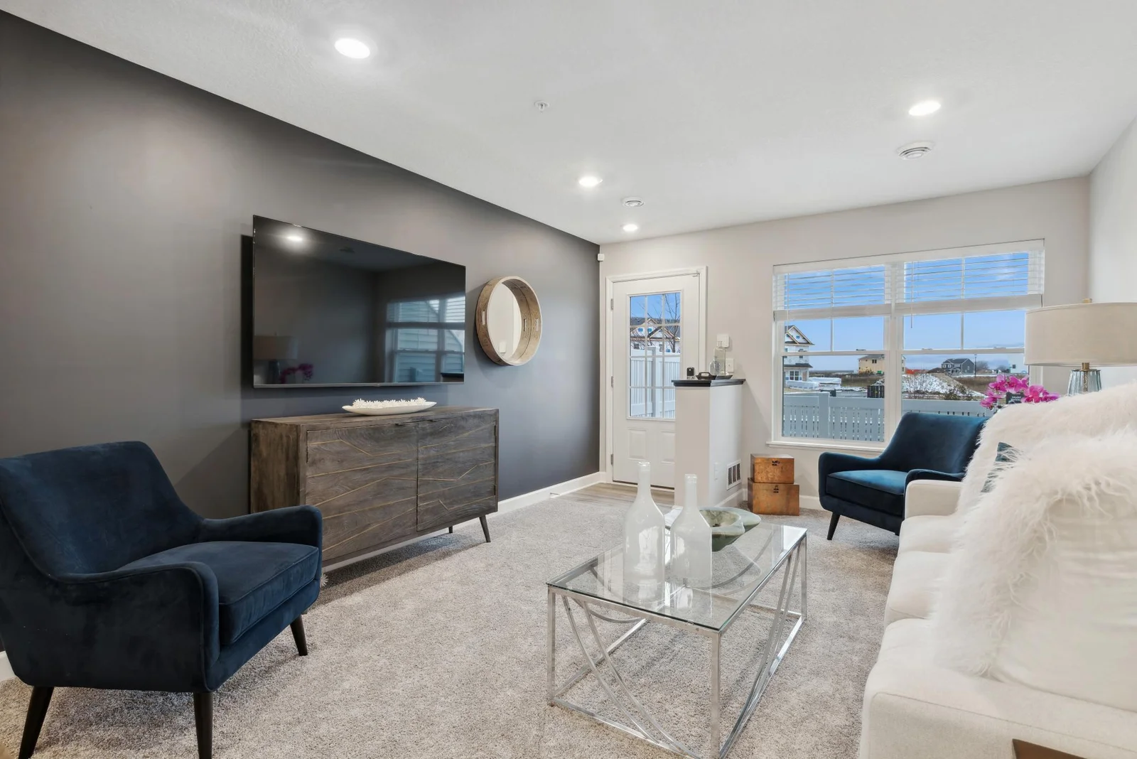 (Photo of decorated model, actual home's finishes may vary slightly) Lovely and inviting Great Room that features large windows for plenty of natural light.