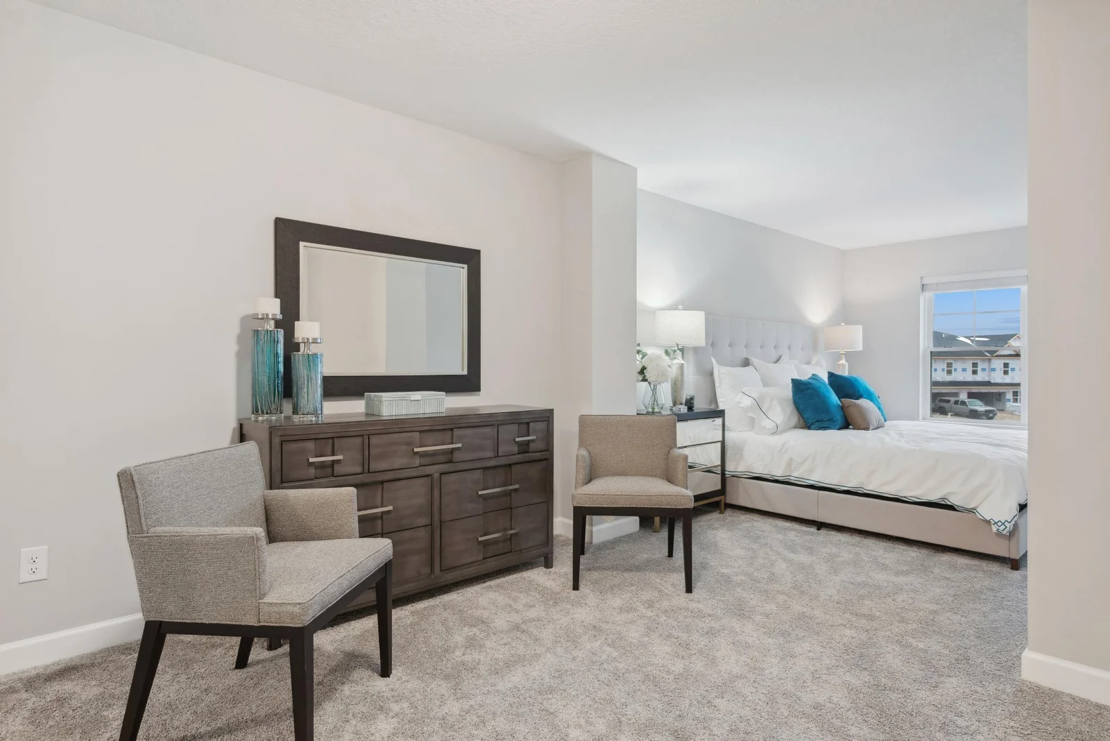 (Photo of decorated model, actual home's finishes may vary slightly) The owner's suite retreat is the perfect place to unwind.