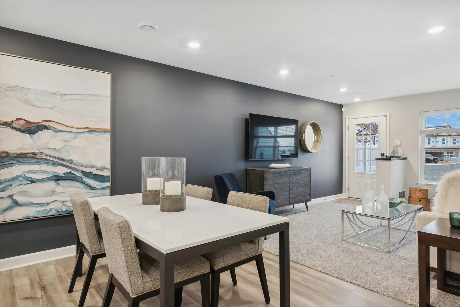 (Photo of decorated model, actual home's finishes may vary slightly) The main level seamlessly transitions from room to room while maintaining an open-concept layout throughout.