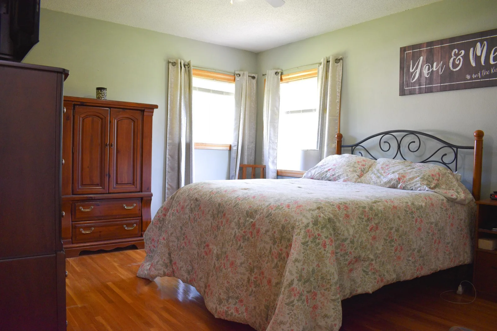 Primary bedroom with hardwood floors