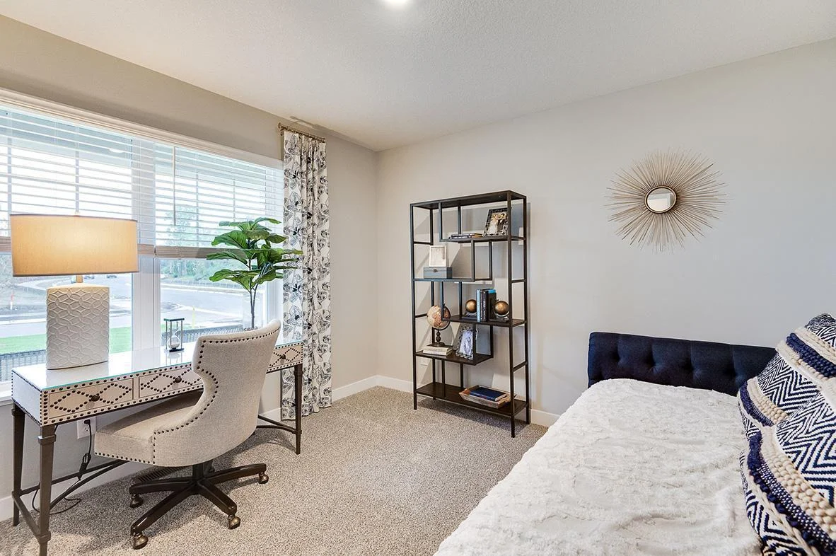 In addition to the vast living spaces on the main level, open the double doors & you are greeted by a bedroom- which can be multi-functional, & serve as a home office too, how will you use this space? Photo of model, colors and options will vary.