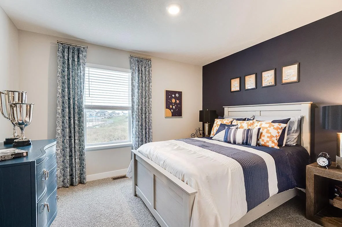 In addition to the primary bedroom, the home's upper level also includes these two additional bedrooms, and another full bathroom just adjacent to each! Photo of model, colors and options will vary.