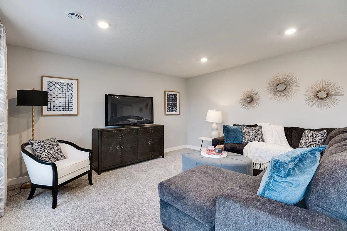 All of that living space up - plus this INCLUDED FINISHED lower level which features an over-sized bedroom with a walk-in closet, another full bathroom plus a giant family room! Photo of model, colors and options will vary.
