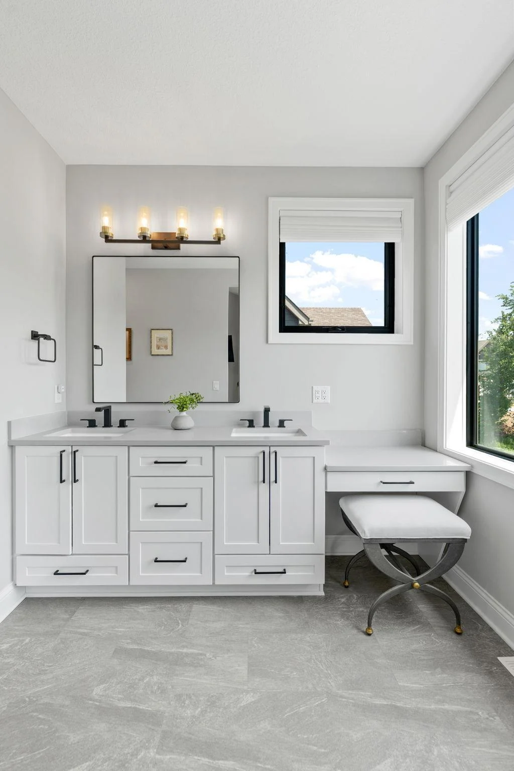 Master 3/4 Bathroom features an enameled vanity cabinet with make-up counter, quartz countertop and dual sinks