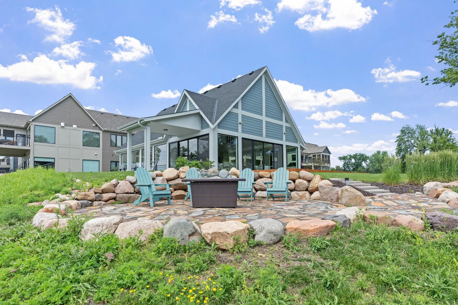 Enjoy moonlit nights on the stone patio with gas fire pit which overlooks Hanrehan Lake