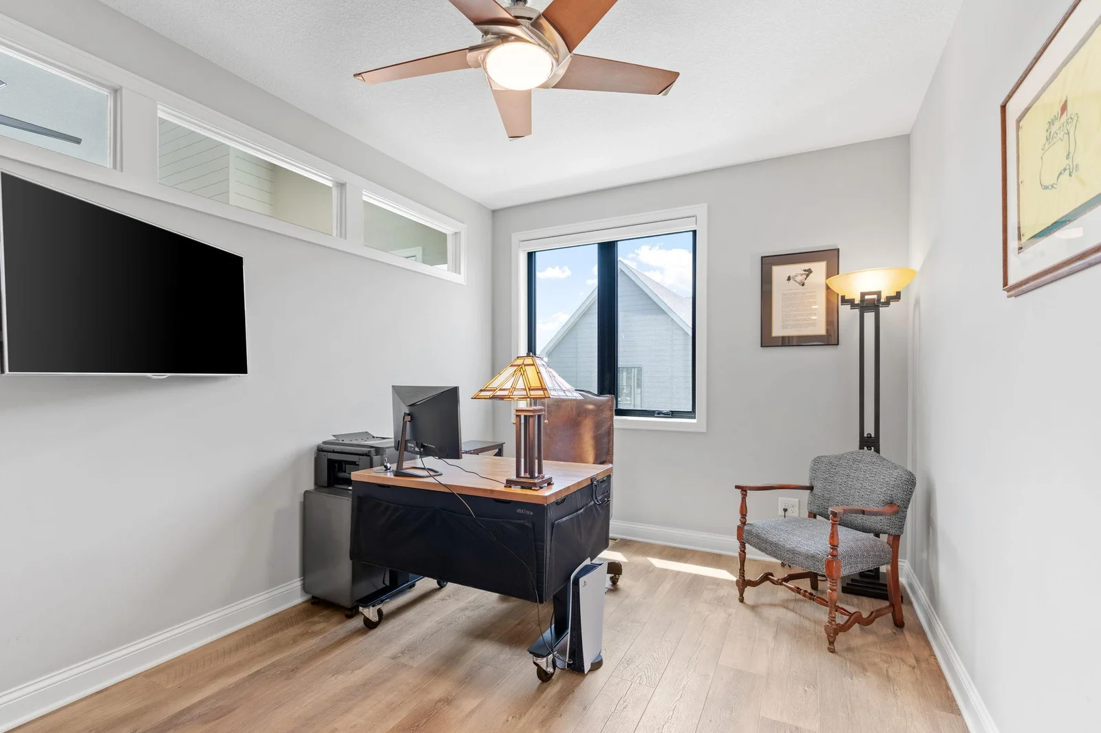Pair of full glass french doors open into this carefully tucked away space ~ the office. Built-in select alder cabinet which offers storage and display shelving - Interior windows transfer natural light from the Great Room!