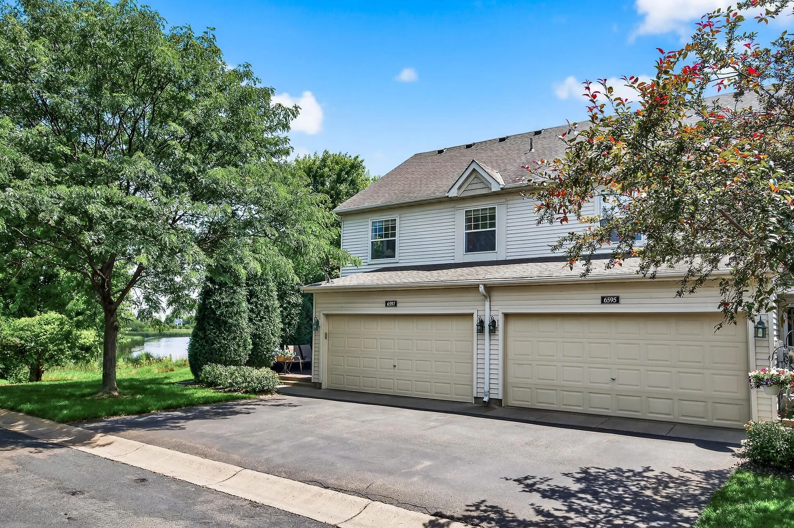 Corner unit with lake AND pond views, 2 car garage