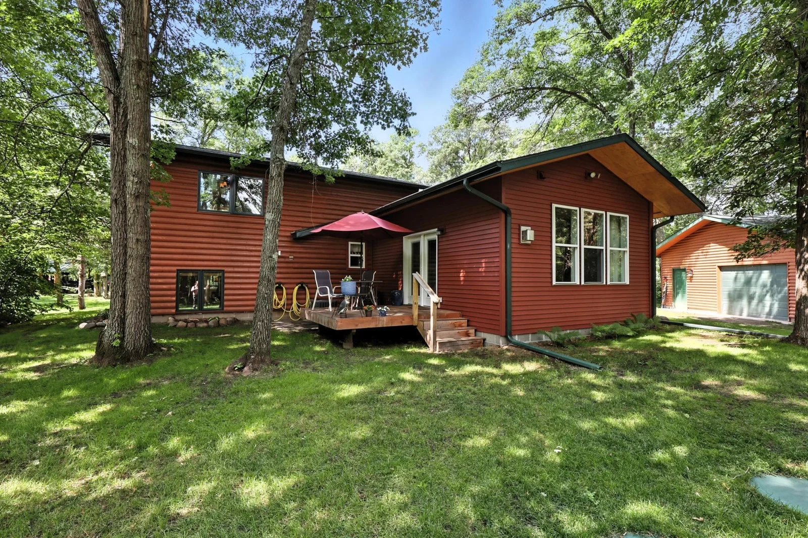 Step out onto the back deck surrounded by mature trees—perfect for relaxing in nature with morning coffee or evening cocktails.