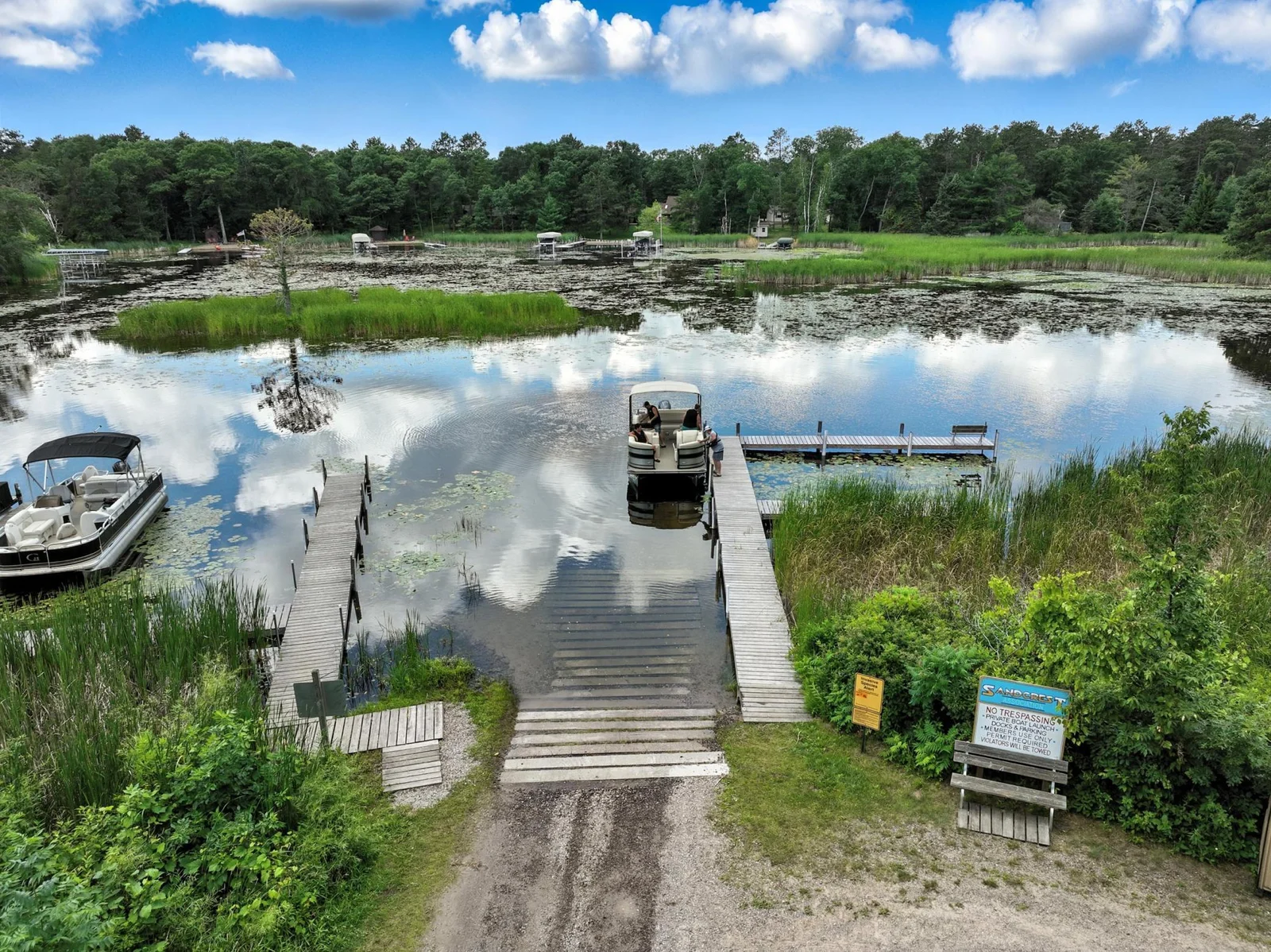 Convenient private on-site boat ramp with day docking available in a quiet bay—ideal for stress-free lake access.