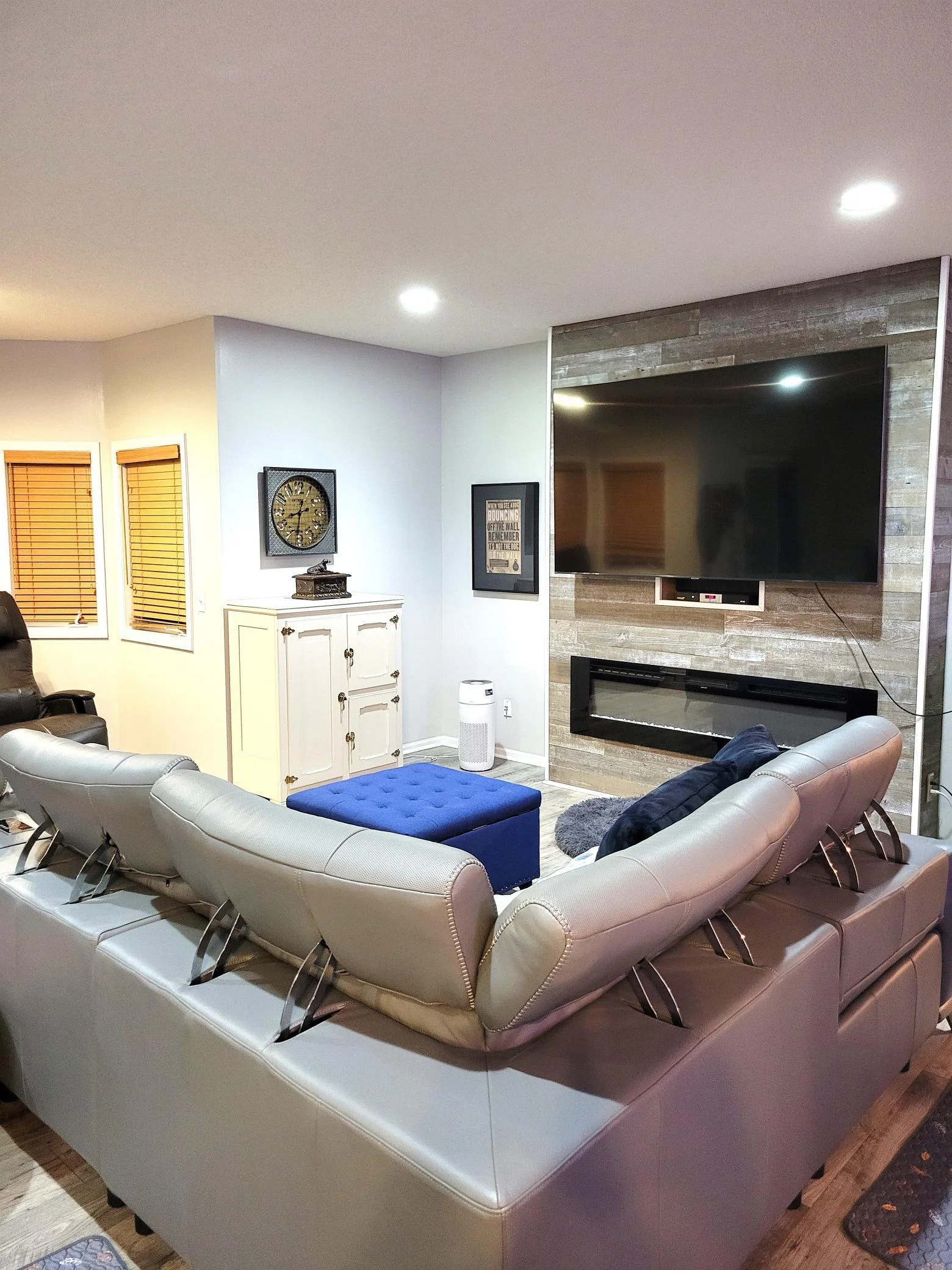 lower level family room with electric fireplace