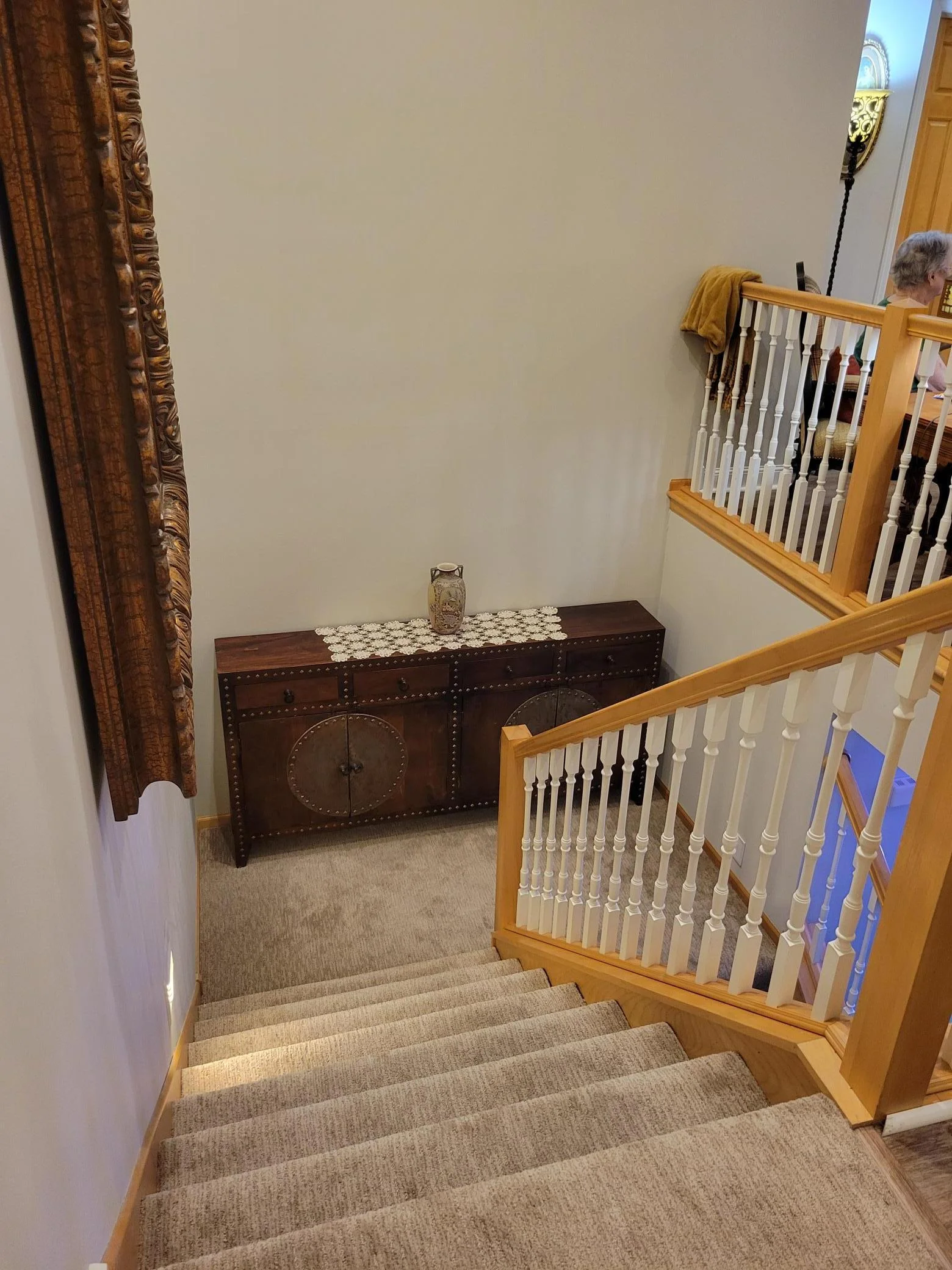 stairs to lower level with landing