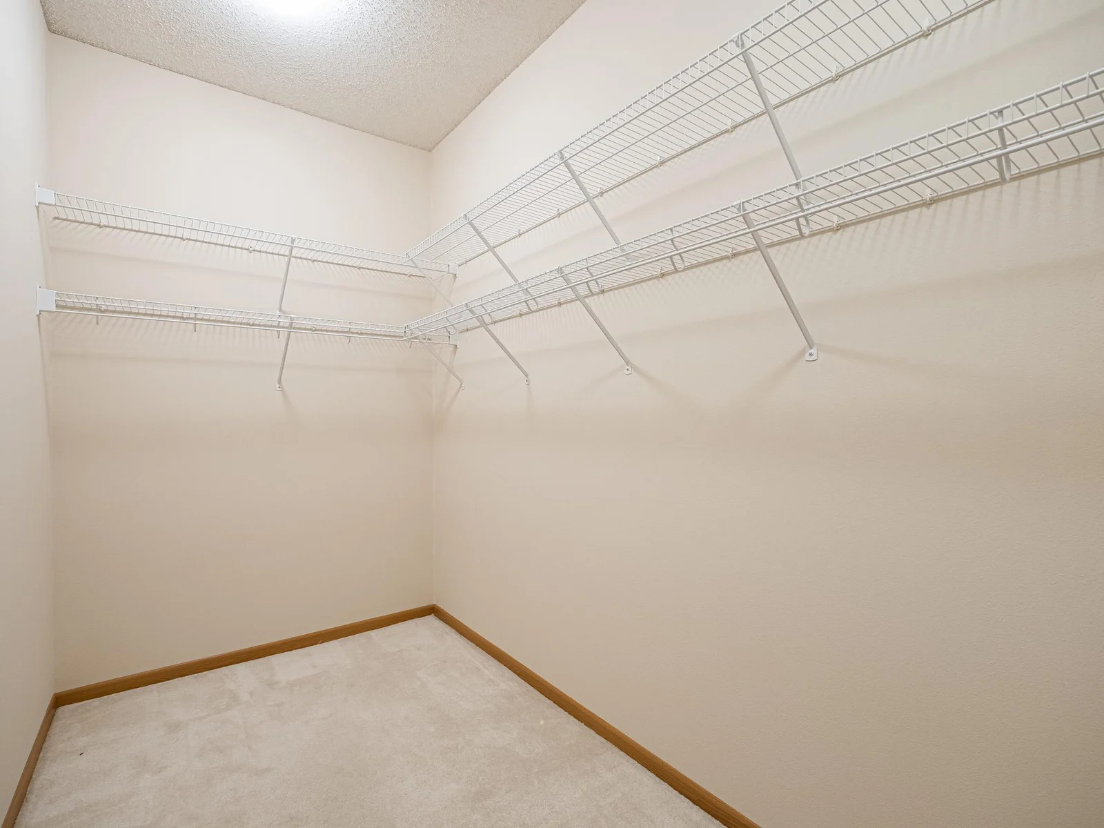 Huge walk-in closet in the primary bedroom suite.  Plenty of room for a dresser.