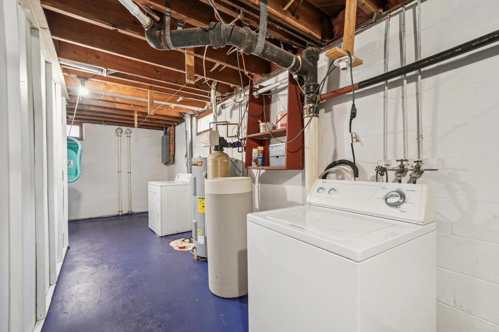 Lower level laundry room. This home has Complete Basement Systems drain tiling installed.