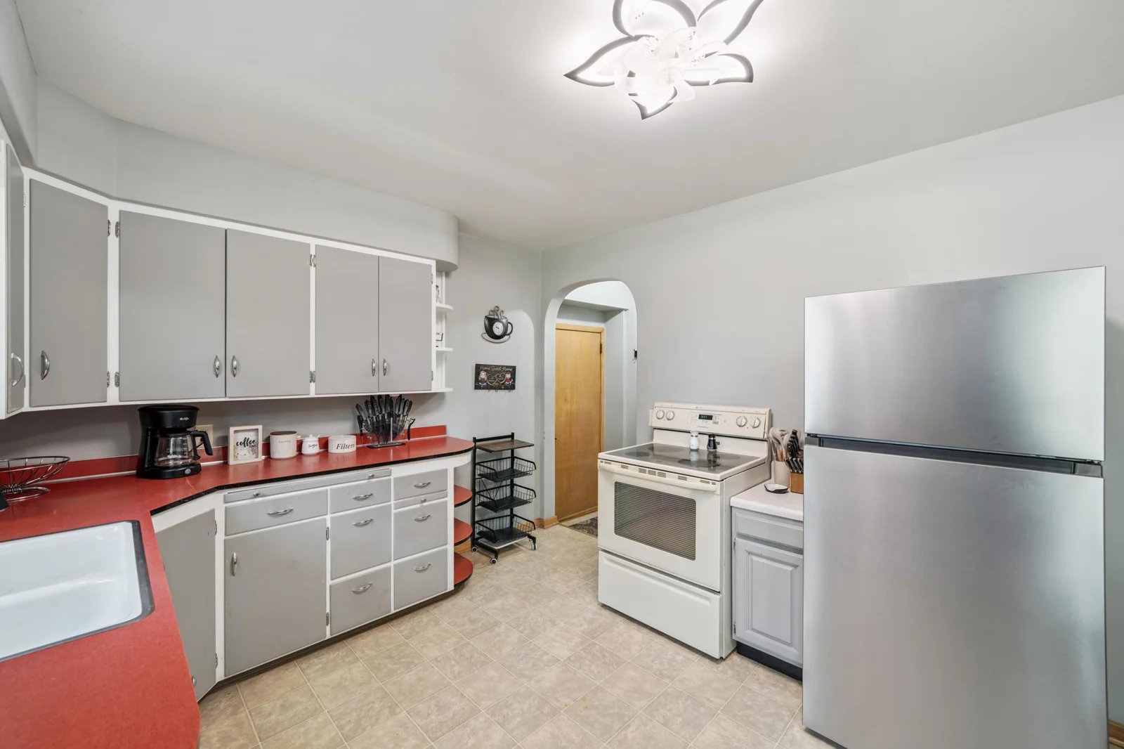 The electric range and S.S. refrigerator are included.
