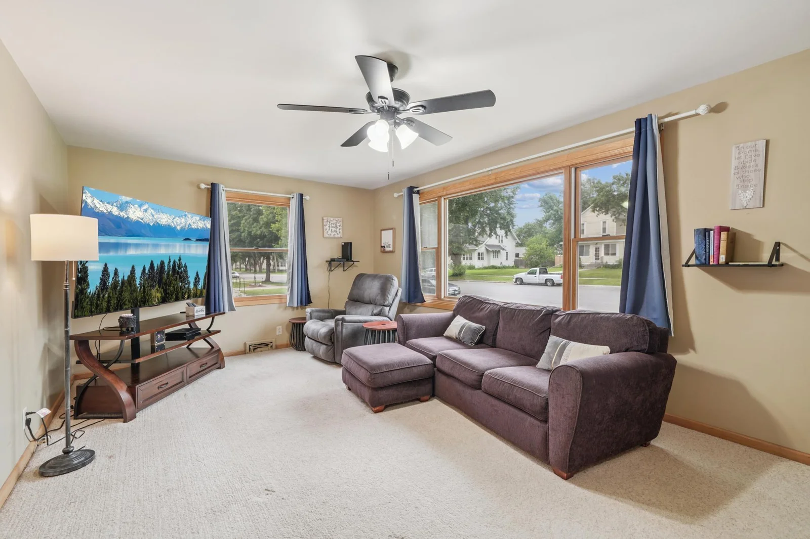 Living room features large windows to let in lots of natural light.