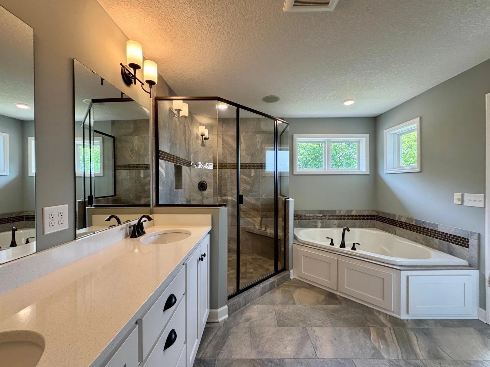 The primary bathroom features a very large tiled shower, soaking tub and walk in closet.
