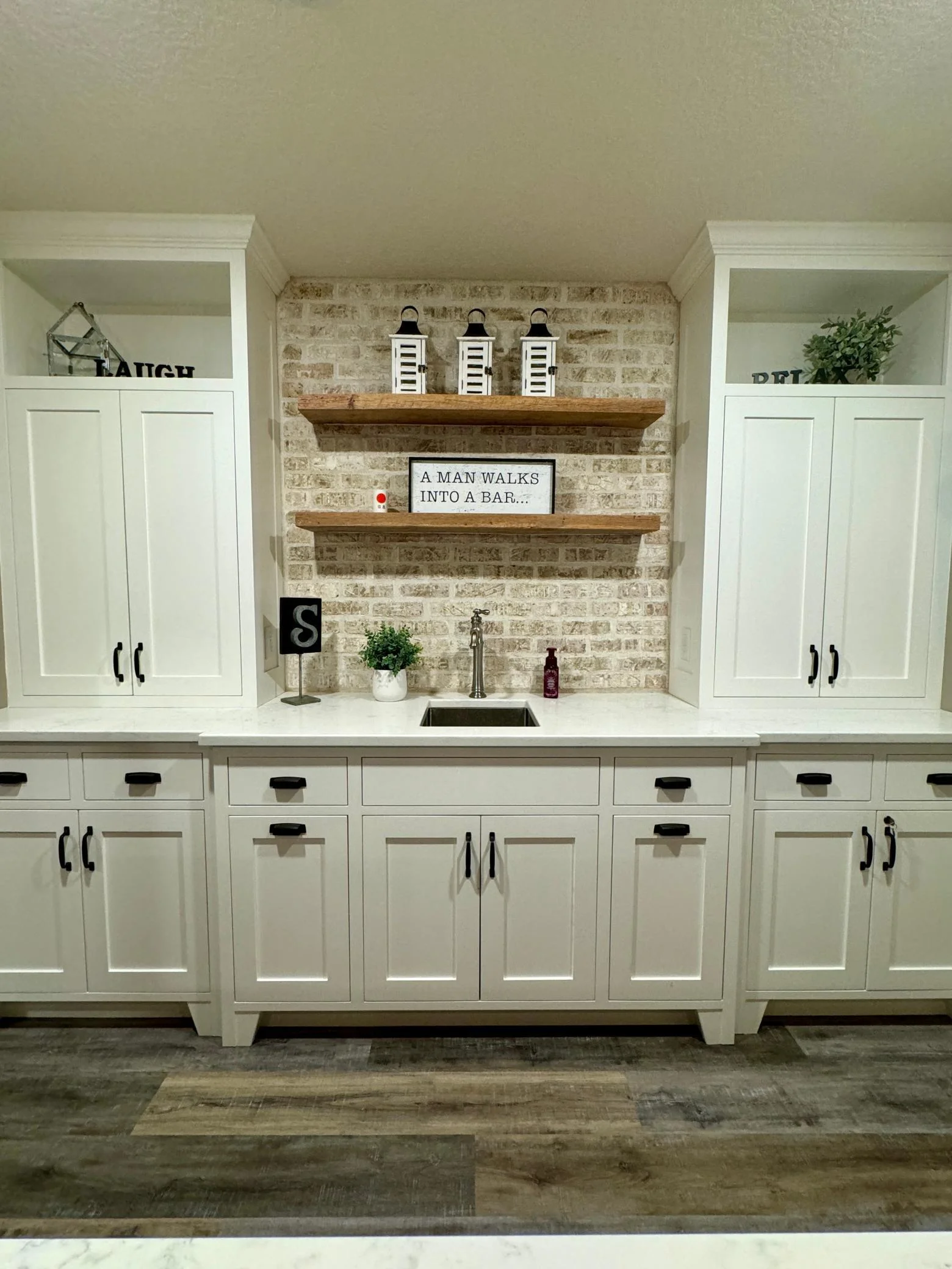 High-end custom cabinets with tons of storage in the lower level bar!