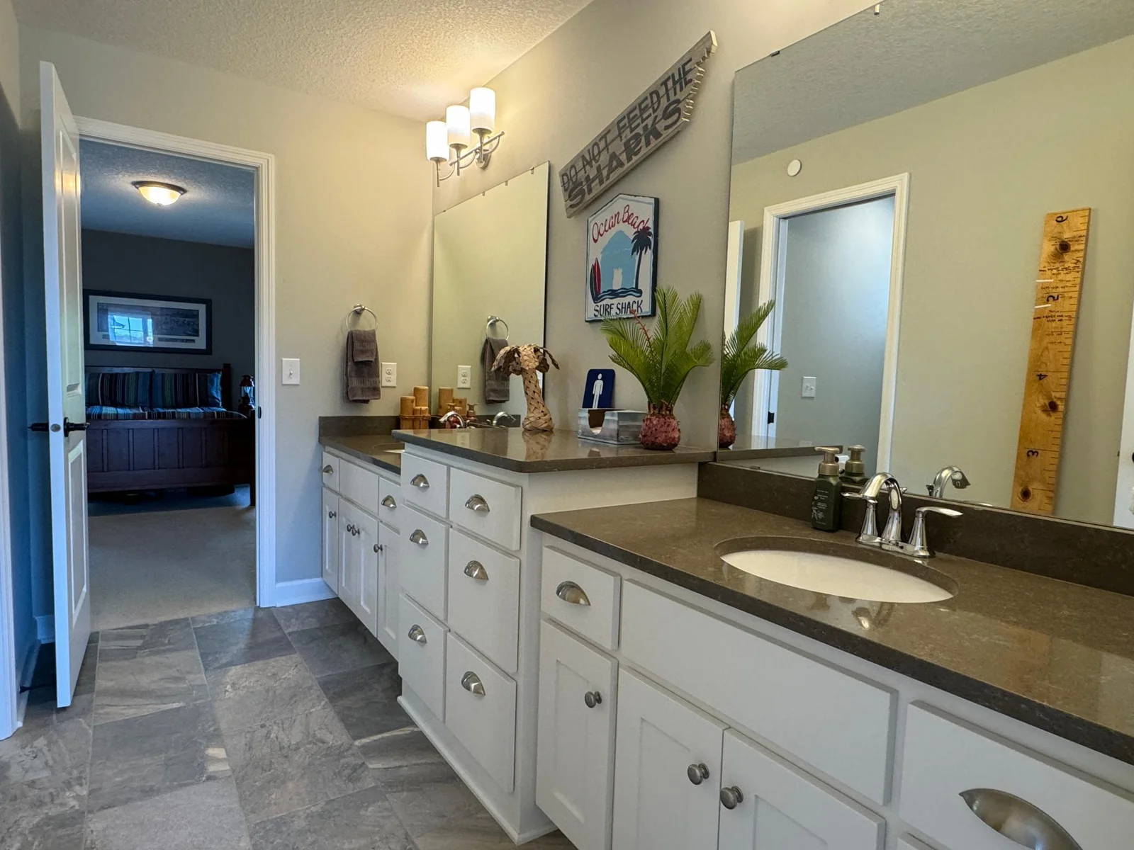 Joining bedroom 3 and 4 is a huge jack and jill bathroom with tile floor, upgraded counter tops and cabinets galore!