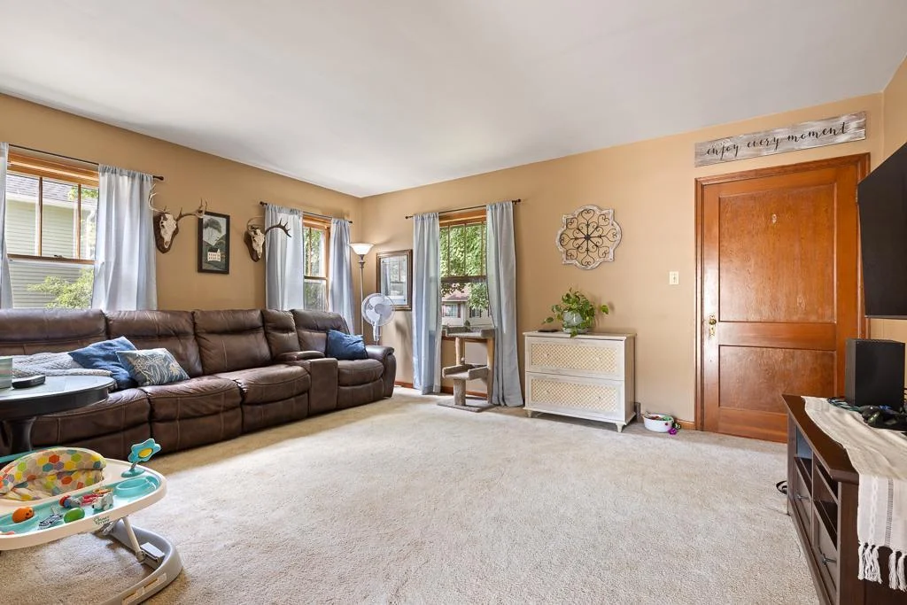An inviting, spacious living room upon stepping in the front entryway