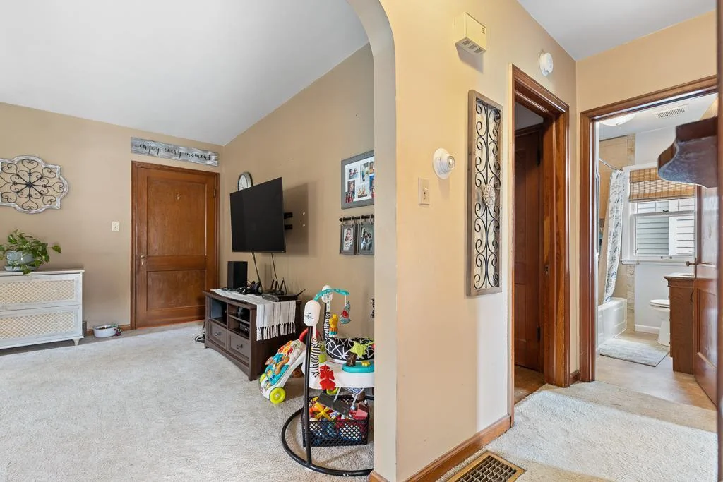 Just between the living room and kitchen is the hallway to the bedrooms and bathroom