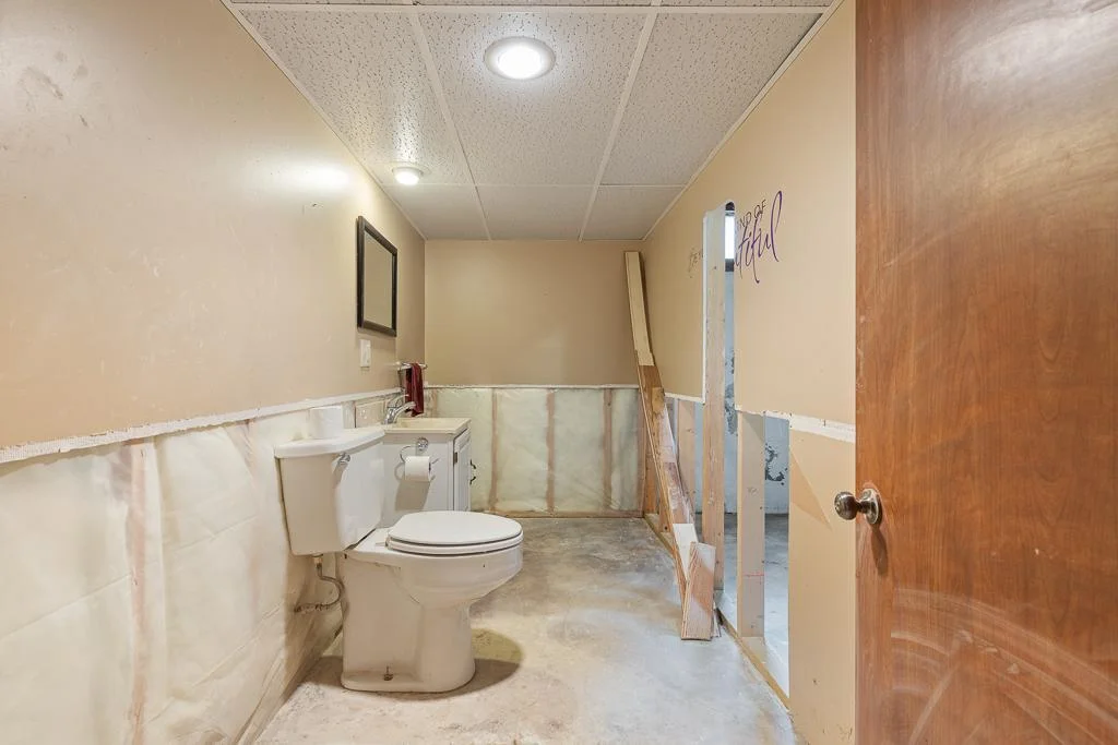 A half bath adds to the functionality of the basement living space