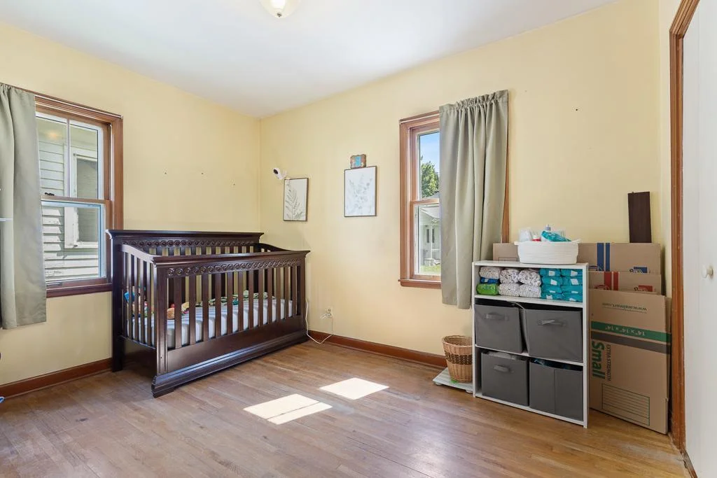 2nd Main floor bedroom just across from the primary - also features hardwood flooring. Perfect for a small family, guest room, or home office!