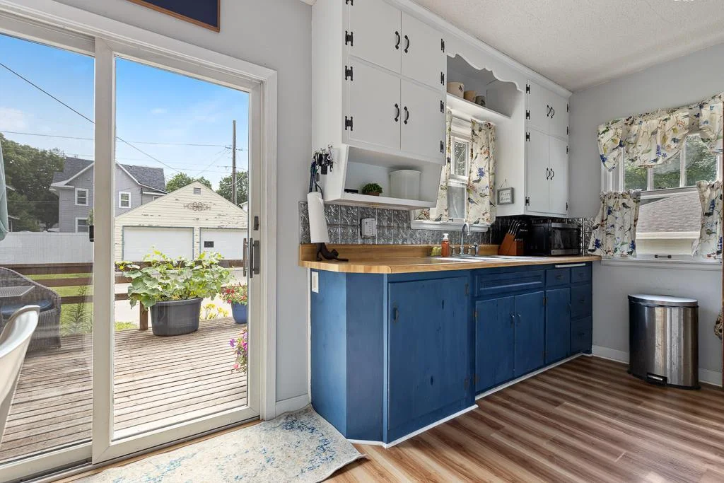 Stepping inside the patio doors from the deck into a quaint, functional kitchen
