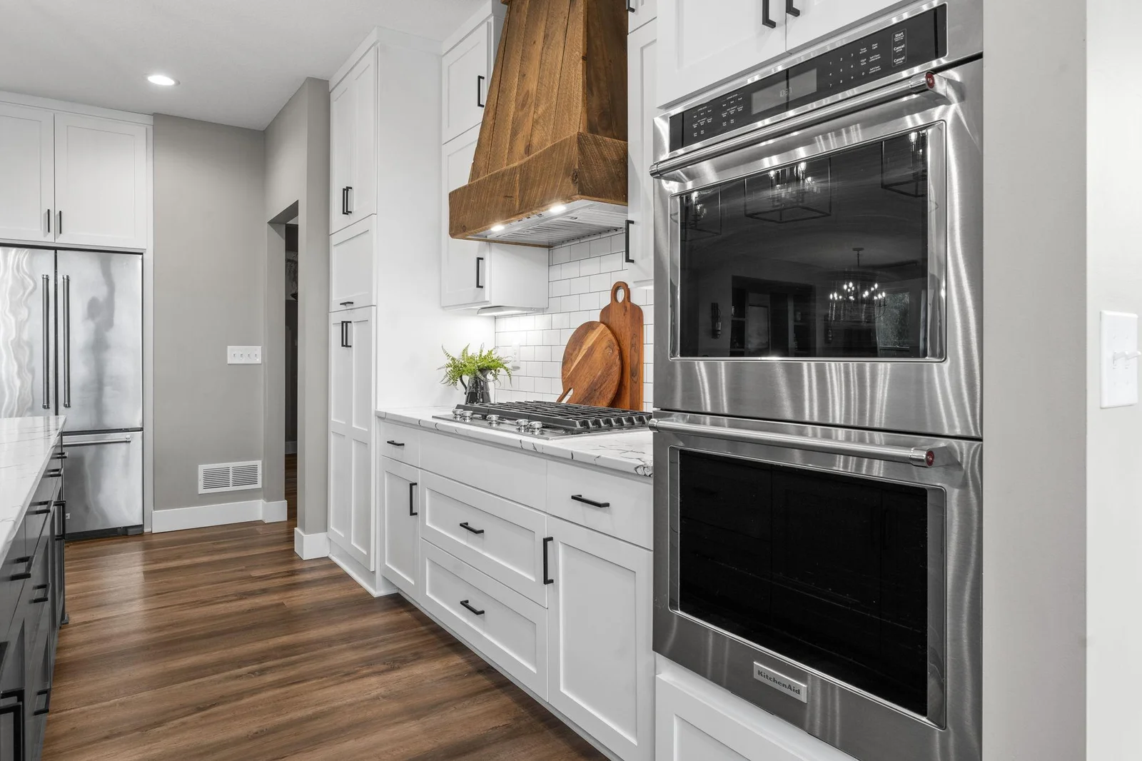 A different angle highlighting the contemporary design and sophisticated finishes of this beautiful kitchen.