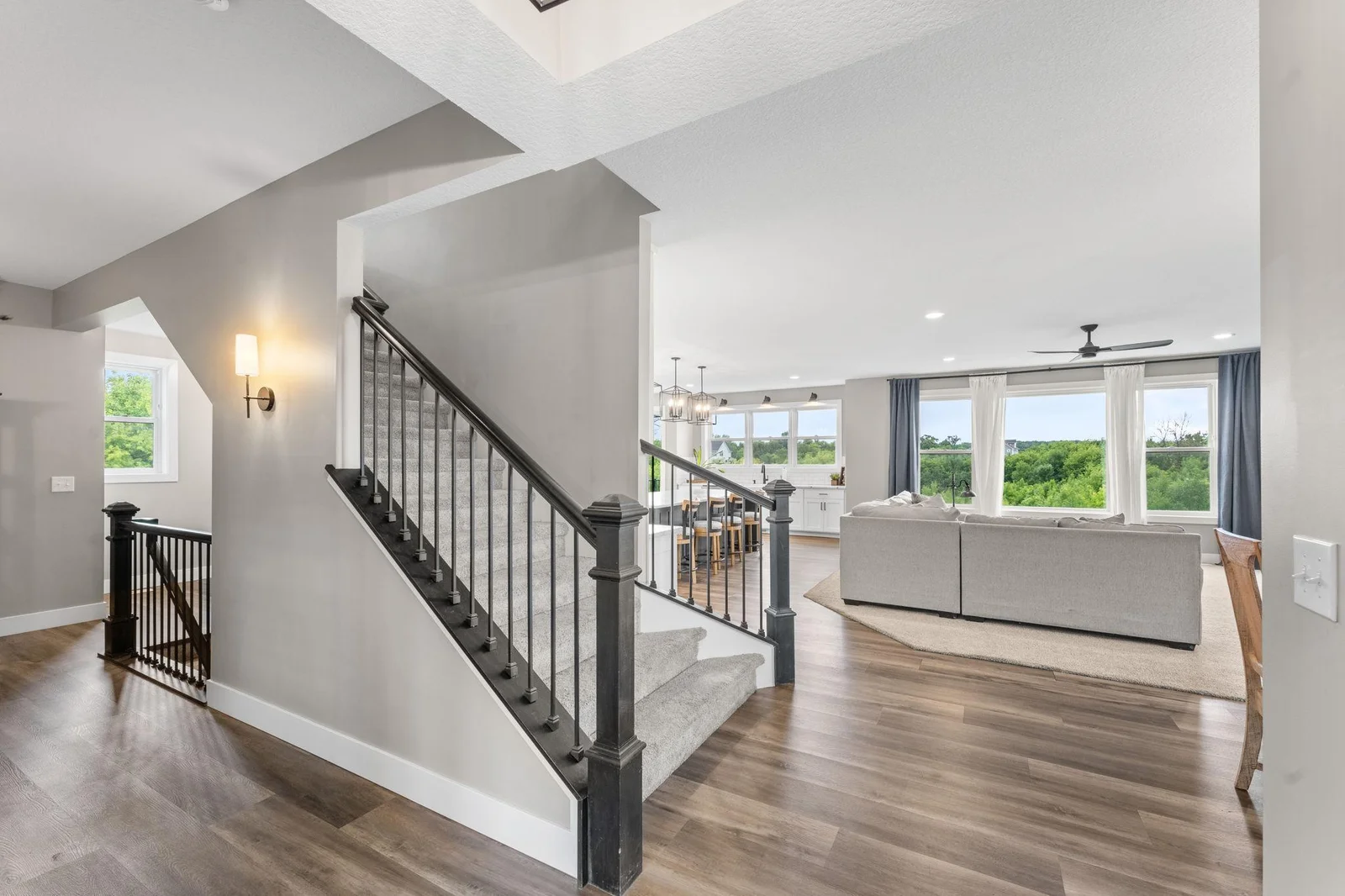 This bright and open main level features beautiful natural light, seamless flow, and picturesque views from nearly every window.