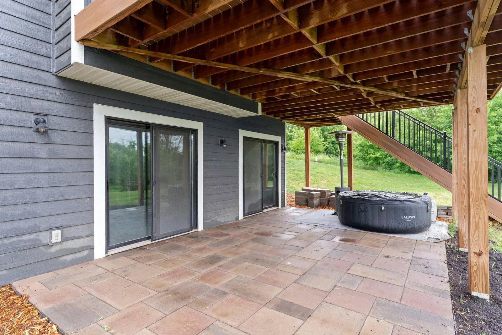 The expansive outdoor patio, conveniently accessible from the basement.