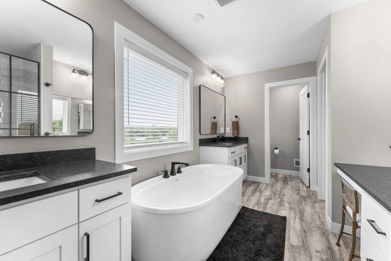 A different perspective showcasing the luxurious private primary bathroom.