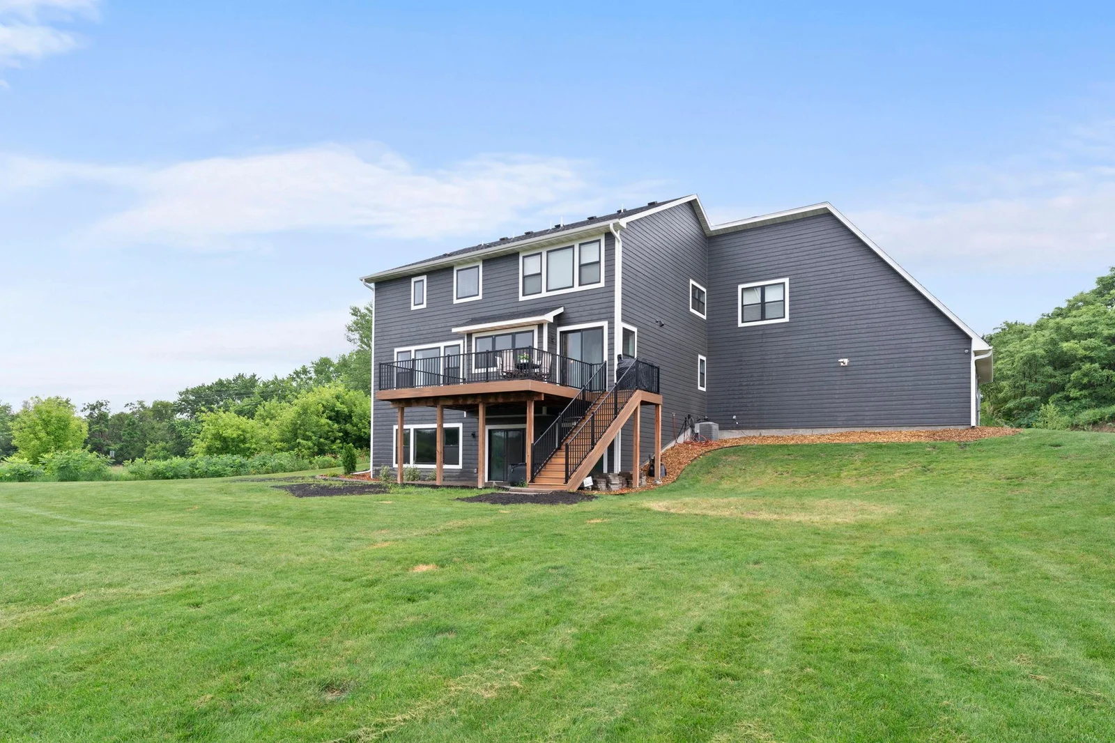 Huge yard, huge deck and all the upgrades: LP SmartSide siding, Andersen windows, maintenance free decking and a paver patio beneath the deck.
