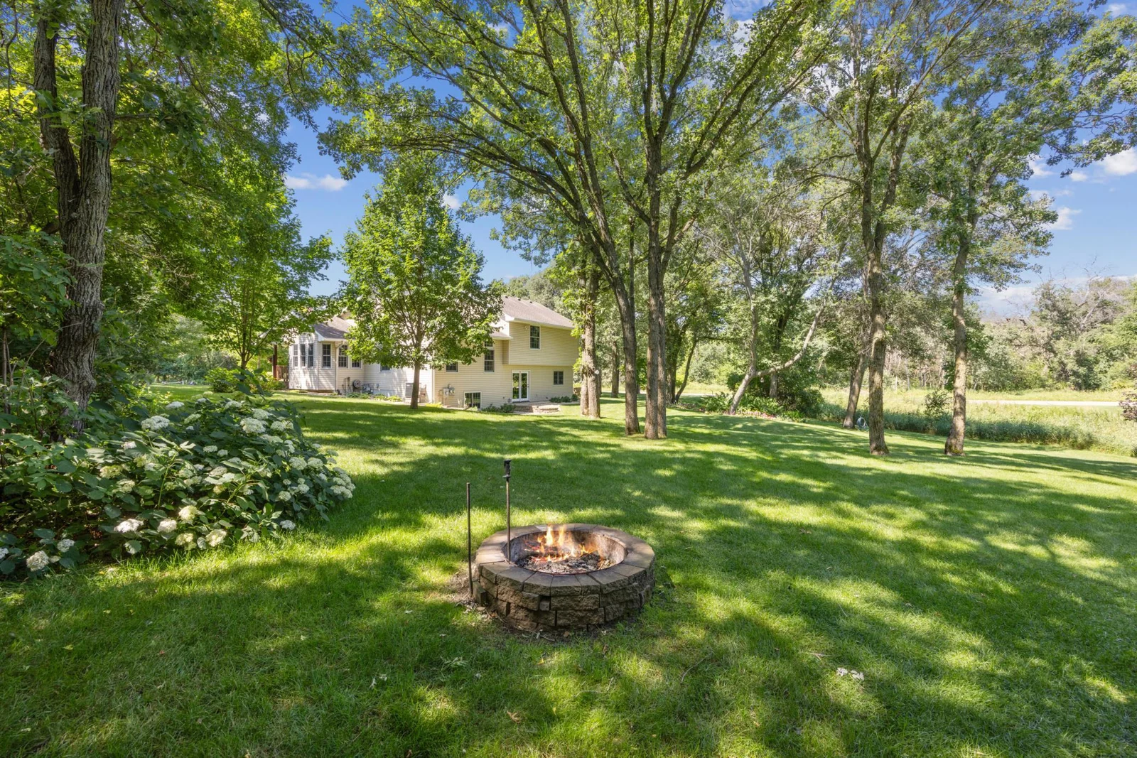 Relax and enjoy the backyard from the great firepit.