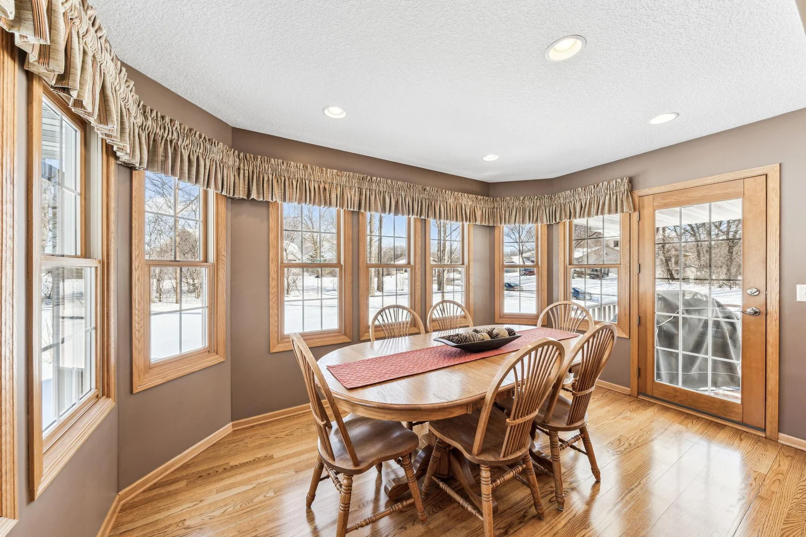 Great dining room space is open from the kitchen and features hardwood floors and a ton of natural light.
