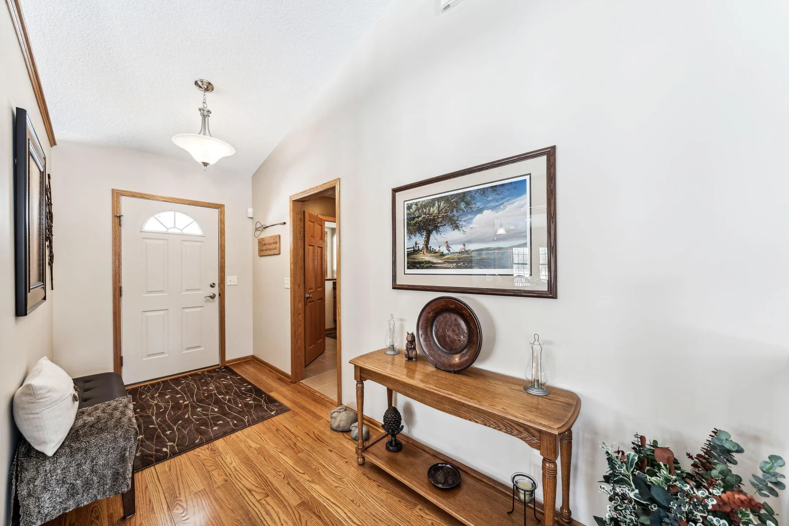 Entryway with hardwood floors greets you as you enter the home.