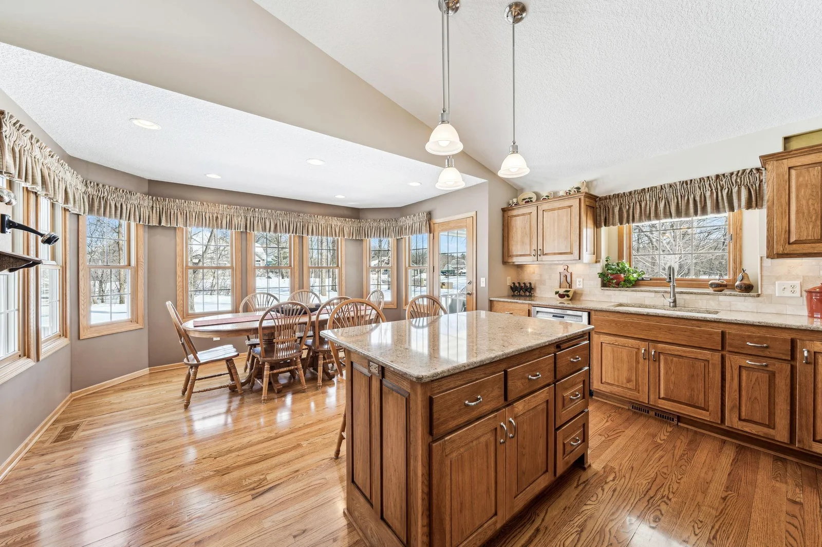 Kitchen has a nice sized center island and open to the dining room space / breakfast room.