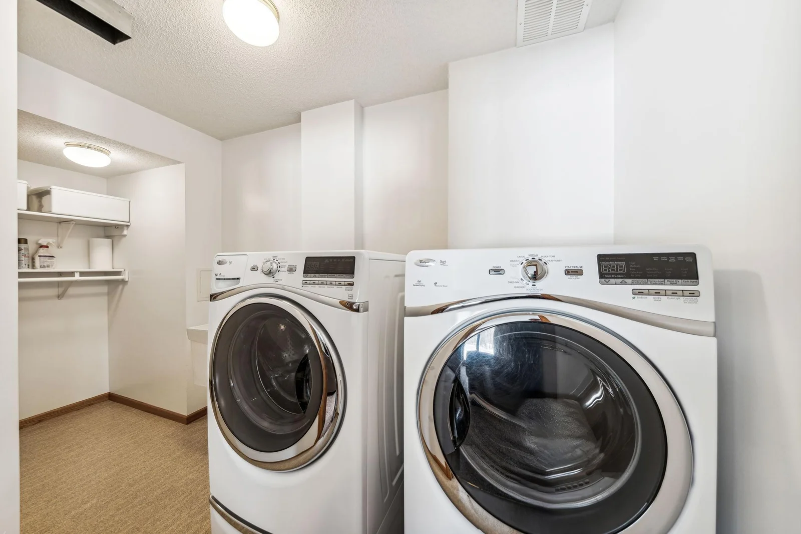 Laundry room with front loading washer and dryer.