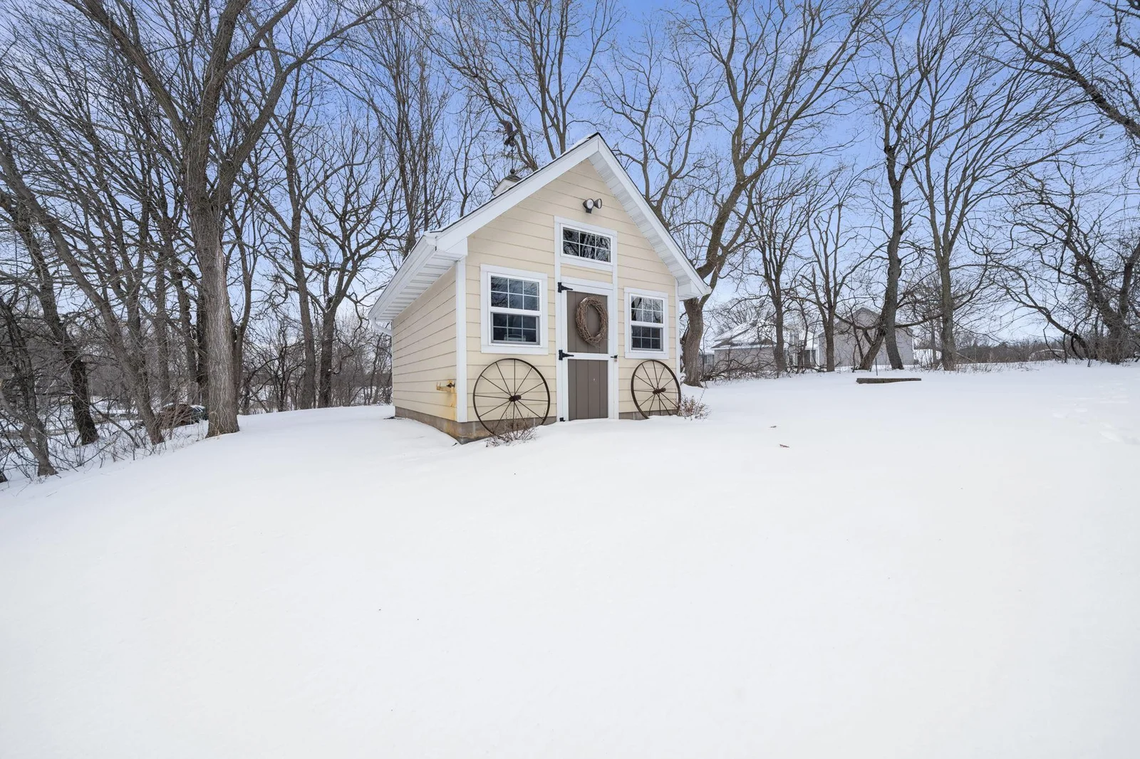 Picturesque and private backyard with charming shed.