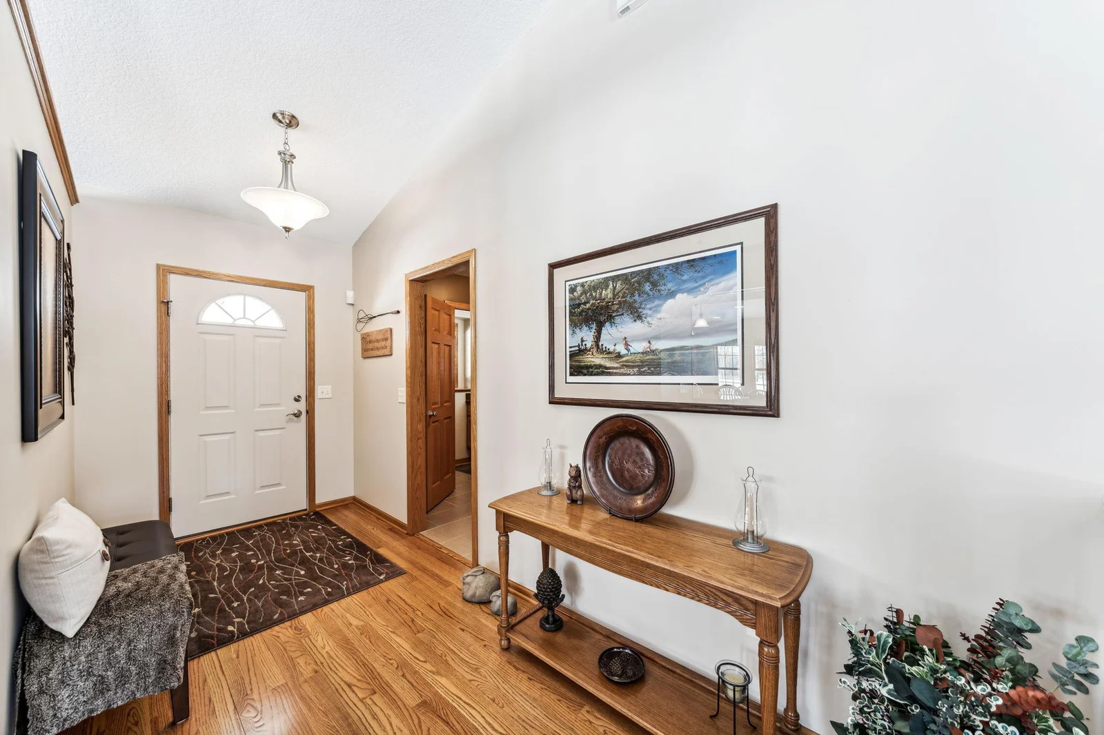 Entryway with hardwood floors greets you as you enter the home.