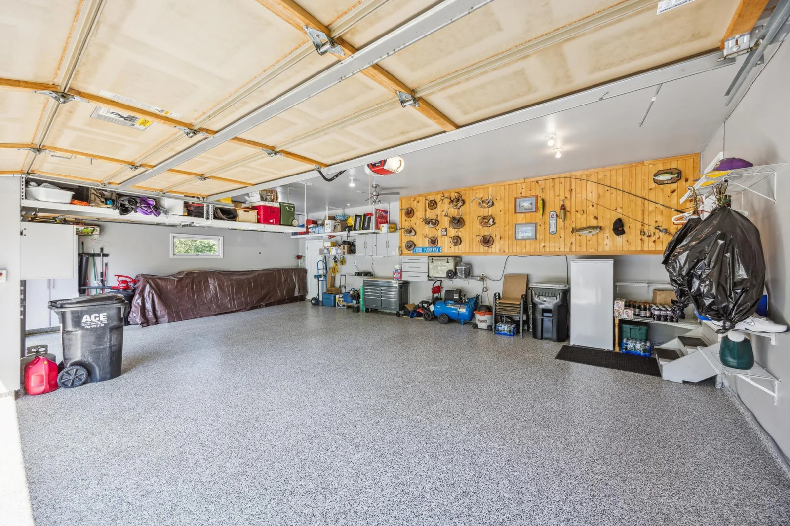 You won't find a cleaner garage!  Epoxy flooring and plenty of space in this large three car garage.